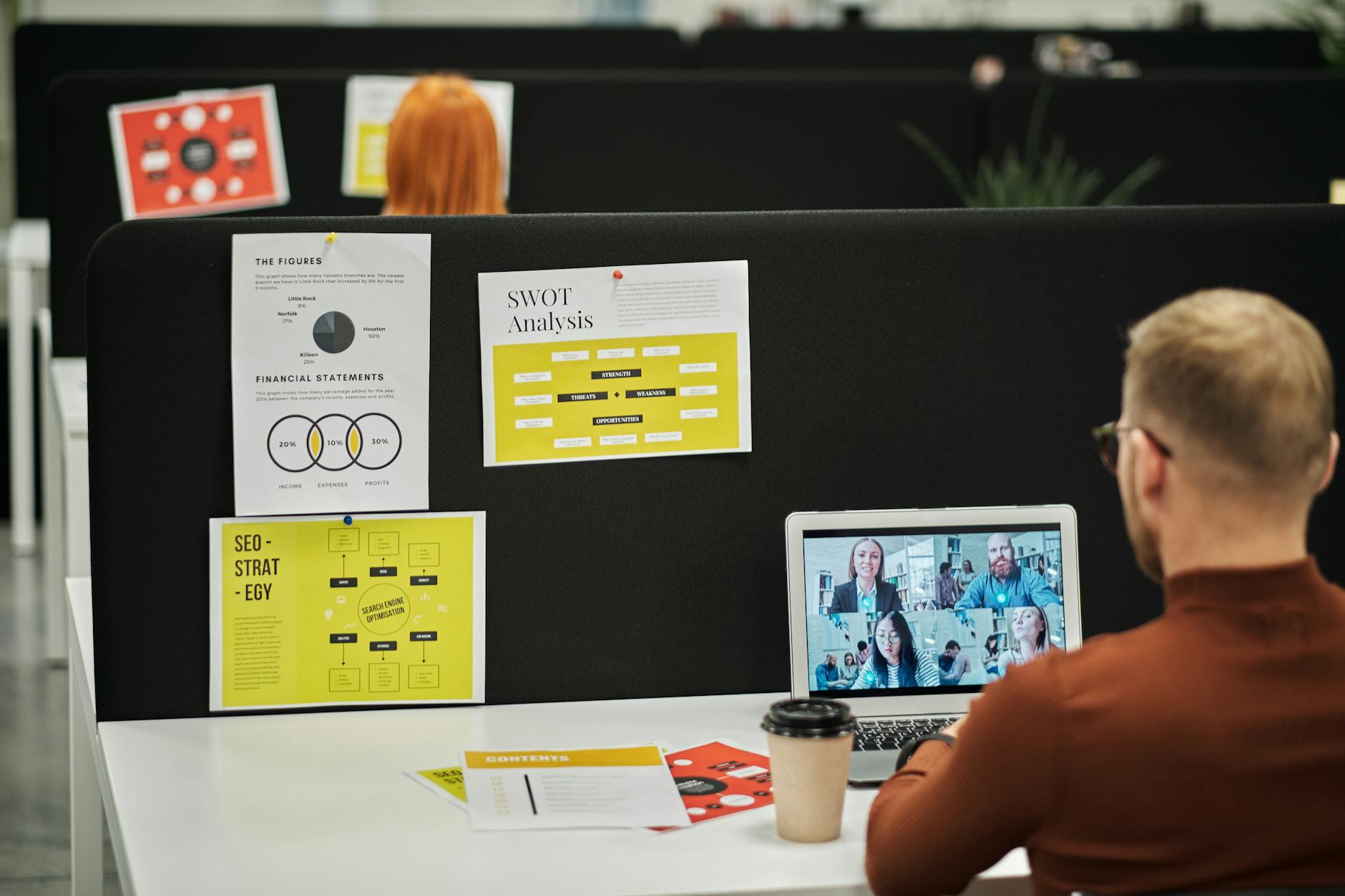 https://www.pexels.com/photo/man-sitting-at-desk-with-laptop-in-the-office-5918386/